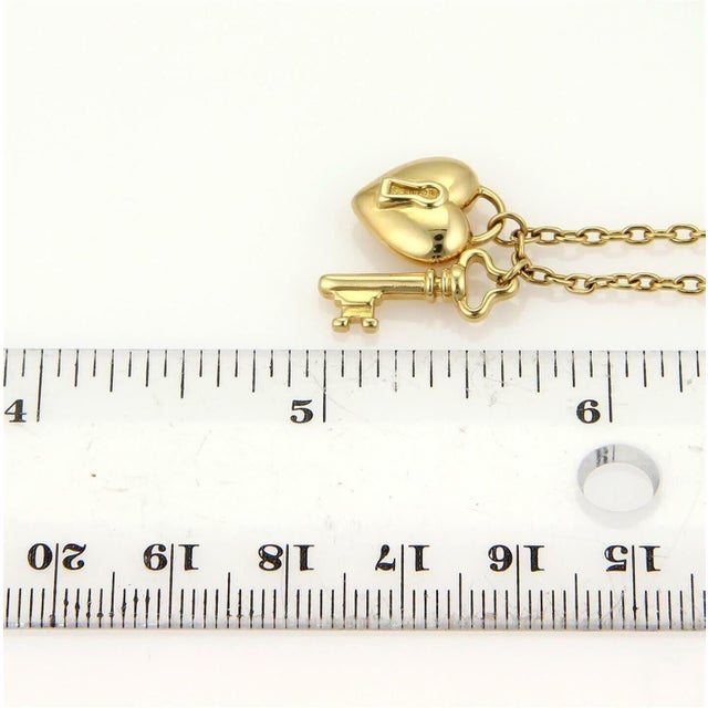 Gold Tiffany & Co.18k Yellow Gold Puff Heart Lock & Key Pendant Necklace For Sale - Image 8 of 9