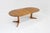 Vintage Danish round extendable dining table from the 1960s made of solid teak wood. This Danish dining table can be...