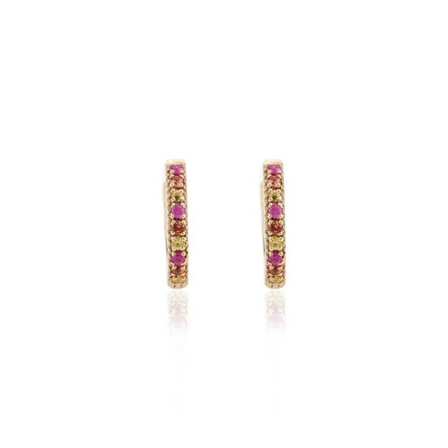 This is part of Chairish’s Fine Jewelry assortment. Multi Sapphire Everyday Huggie Hoop Earrings in 18K Gold to make a...