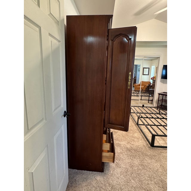 A complete cherry queen headboard bed wall unit by American furniture maker, Thomasville. This unit consists of queen size...