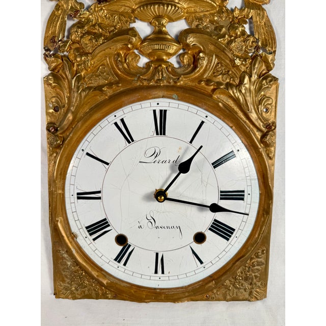 A fabulous find. Imagine having all of the beauty of an antique, enamel-faced, carved, repousse clock, without the burden...
