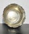 This is a Decorative silver plate bowl with a rolled and scalloped rim. Arts and Crafts design in simple tabletop...