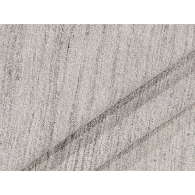 Handwoven in India using a combination of wool & viscose this Kilim has been styled on the clean and simple look of...