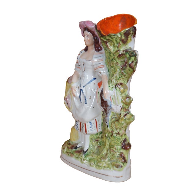 Antique 19th century Staffordshire porcelain flatback figural hunt spill vase depicting a young woman carrying game - a...