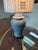 A Haig ginger jar table lamp featuring a blue and white ceramic body with an intricate floral vine and scroll pattern. The...