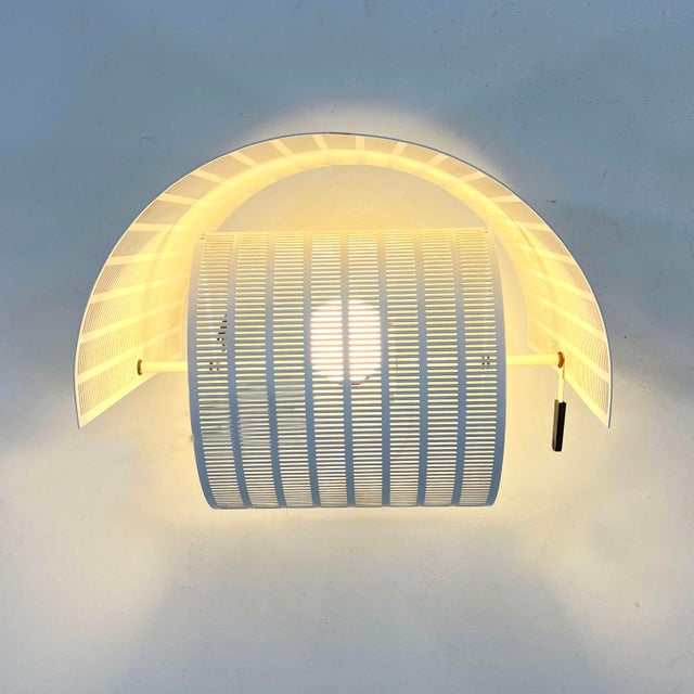 Shogun Wall Lamp by Mario Botta for Artemide, 1980s, in Good conditions. Designed 1980 to 1989 This piece has an...