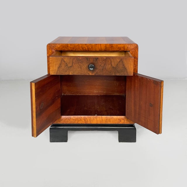 Italian Art Deco bedside table in wood and black wood, 1930s Pair of rectangular wooden bedside tables. The front features...
