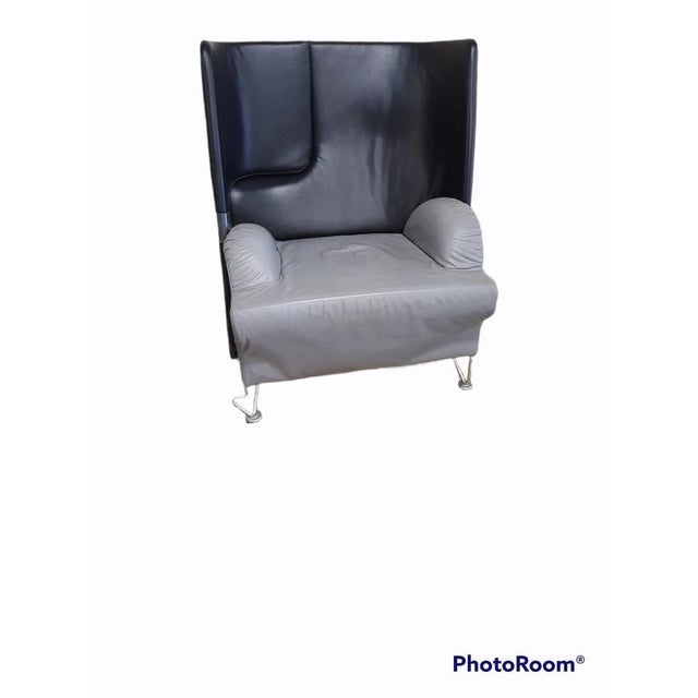 Rare lounge chair with foldable footrest by Brunati / leather / grey - black. with original cushions This piece has an...