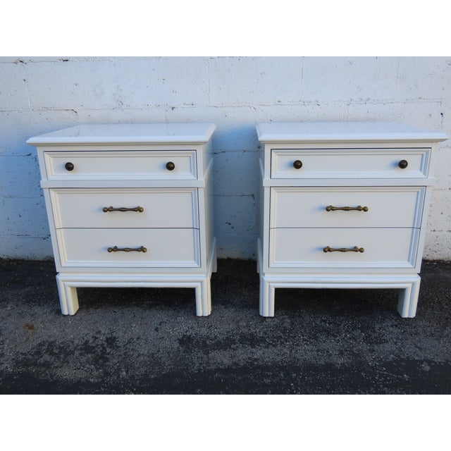 This Pair of Nightstands is made of wood, and metal. This Pair of Nightstands is an excellent example of the Hollywood...