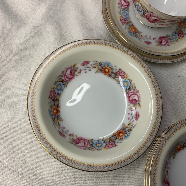 Offered here is a set of vintage Jyoto Occupied Japan China dinnerware featuring a colorful floral wreath pattern and...