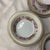 Offered here is a set of vintage Jyoto Occupied Japan China dinnerware featuring a colorful floral wreath pattern and...