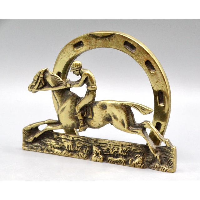 Circa 1930's English Edwardian era letter rack with jockey and racehorse with a horse shoe back plate. It is a handsome...