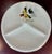 White porcelain serving plate with gold trim in a waffle pattern with three compartments for serving. Decorative bird...
