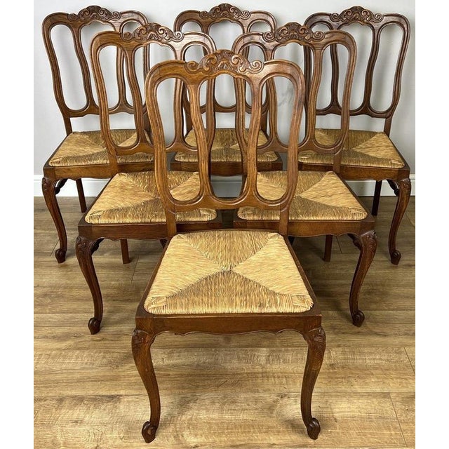This elegant Vintage French Louis set of six dining chairs brings timeless French charm to any dining room or traditional...