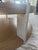 Serene circular solid wood cocktail table made of figured cathedral ash in the dune finish. The legs of this table are...
