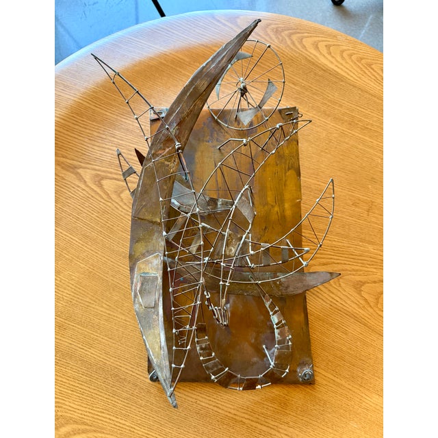 This rare kinetic metal sculpture, dating to circa 1960s, is an authentic mid-century modernist work by artist and...