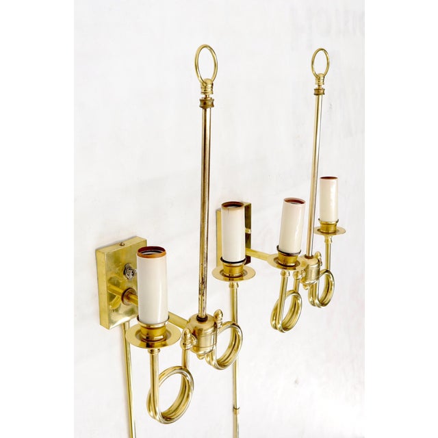 Pair of decorative trumpet shape wall sconces.