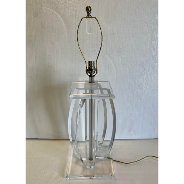 Van Teal style lucite table lamp. This piece has 4 boomerang style pieces connecting the top and bottom bases. Very thick,...