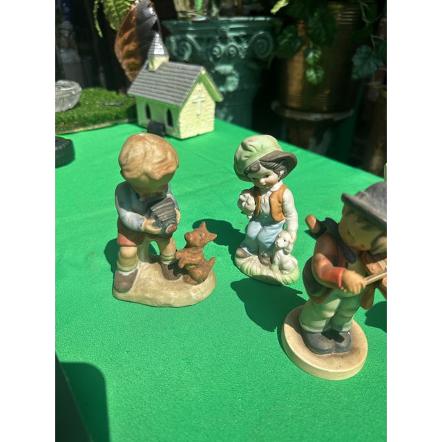 Up for consideration is a beautiful vintage collection of small ceramic playing children figurines. These would look...