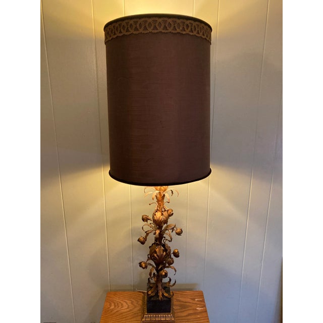 Large impressive lamp with large gold flower blooms. Giltwood base measures 6”.