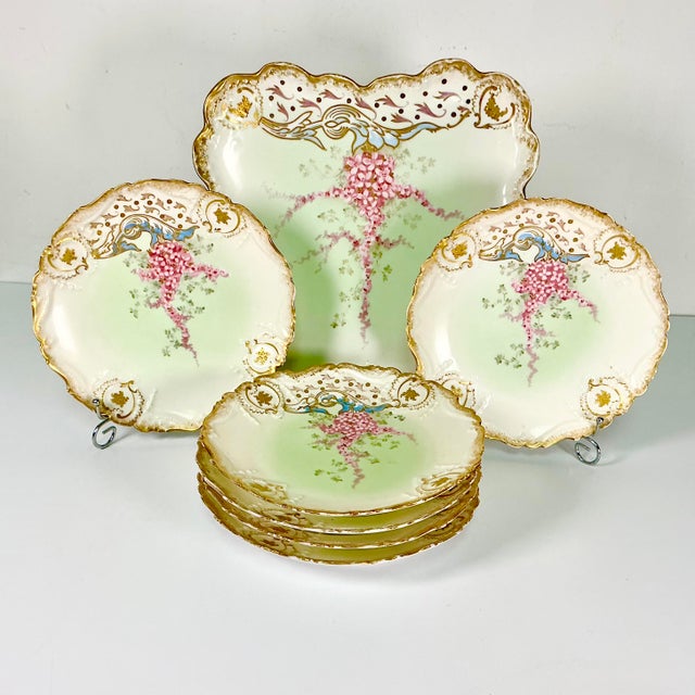 Vintage Home is pleased to present this gorgeous 7 piece Antique Dessert Plates Set from France. They are from the fine...