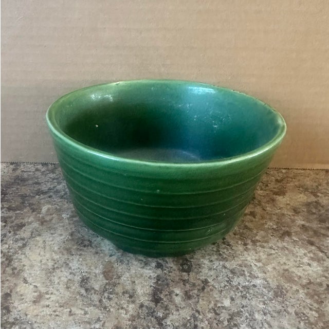 Estate sale find. Marked Brush. A charming vintage green glazed stoneware bowl with classic horizontal ribbing and a rich,...