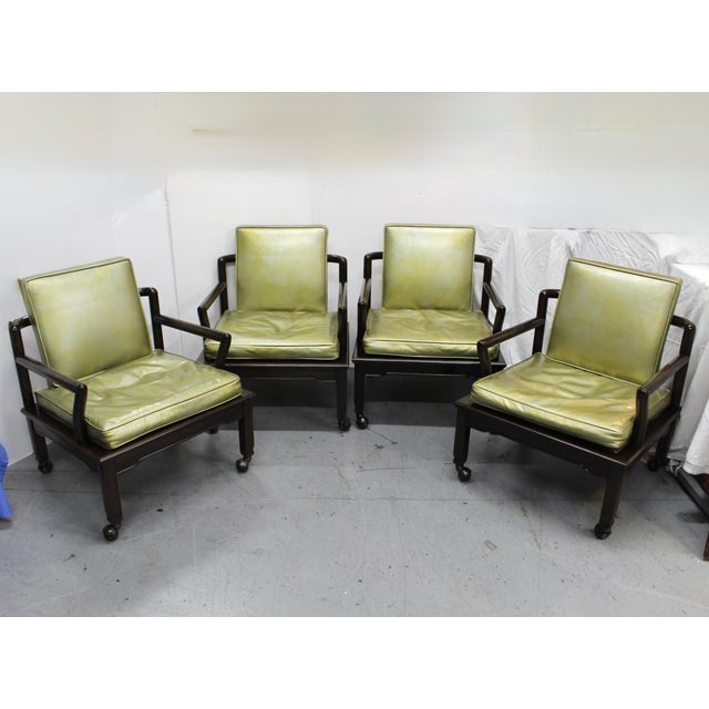 Set of four asian inspired club chairs on casters from Widdicomb Furniture, c1963. Designed with a low profile typical of...