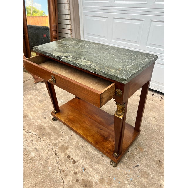 19th-Century French Empire Walnut Console Table — An elegant antique console featuring a rich walnut frame, green marble...
