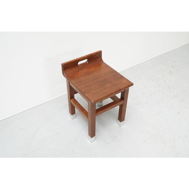 Rare stool in solid oak designed by the Belgian architect Gaston Eysselinck. Originally conceived as part of the interior...