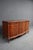 Mid 20th century mahogany dresser with a serpentine front and carved details. Features flame mahogany drawer fronts,...