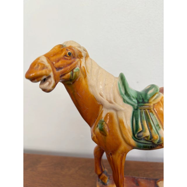 1980s Chinese terracotta drip glaze Tang Dynasty style war horse. Orange, green, and cream aged drip glaze. China, late...
