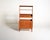 Teak structure with four large drawers, a slanted top, and an open upper section with adjustable shelves. Designed by...