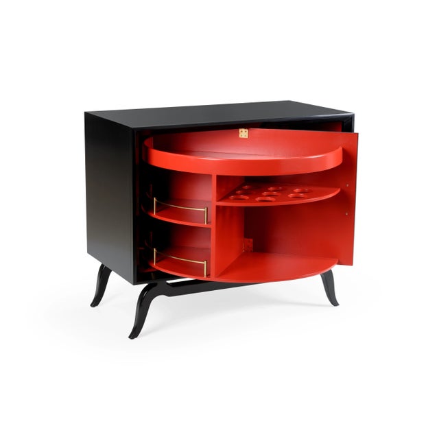 Unique revolving door drinks cabinet. Black painted exterior, red interior. Polished brass inlay on door panel and...
