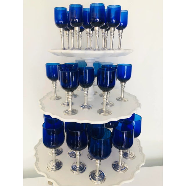 Stunning vintage collection of one of a kind cobalt blue-blown glasses a very rare large collection with pewter stems, it...