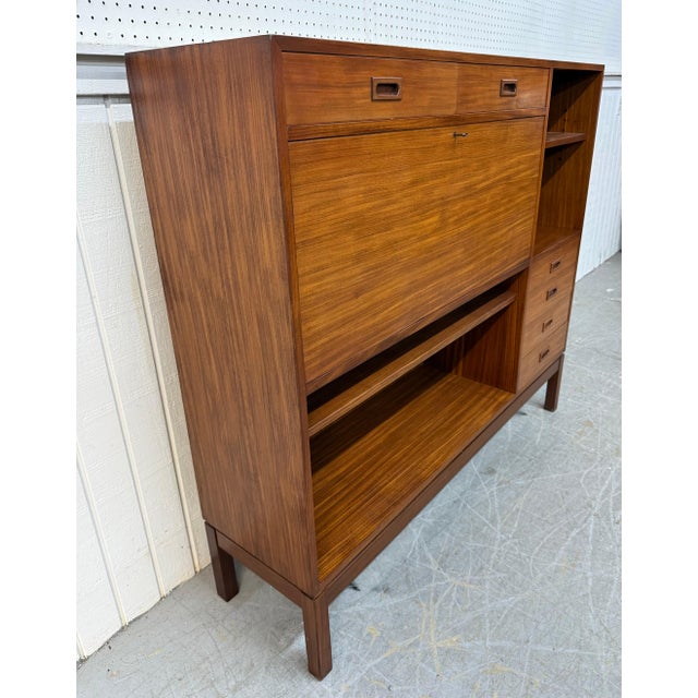 This listing is for a Mid-Century Danish Modern Teak Bar Cabinet. Featuring a straight line design, six drawers for...