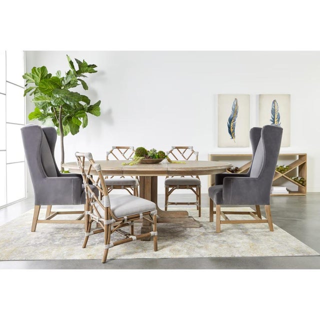 This extendable dining table transforms from a 60-inch round to a 77.5-inch oval configuration, offering flexible seating...