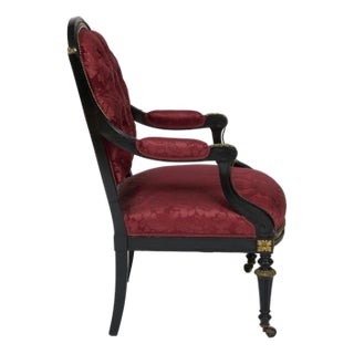 Late 19th Century Victorian or Louis Philippe French Black and Red Gilt Bronze Armchair Upholstered in Red Silk Attributed to Louis Marcotte For Sale