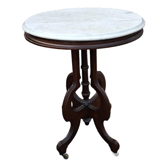 Late 19th Century Eastlake Style Walnut and Marble Tip Oval Rolling Side Table For Sale