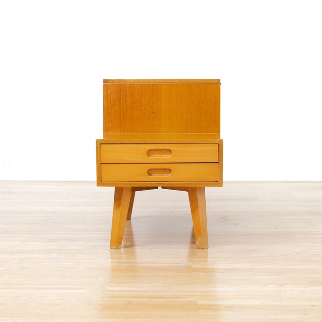 This stunning little sewing box was designed and manufactured by Vanson Furniture during the 1960s. Produced in oak, the...