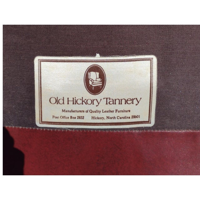 Experience the pinnacle of American craftsmanship with this Rare Cognac Leather Wingback Chair by Old Hickory Tanery...