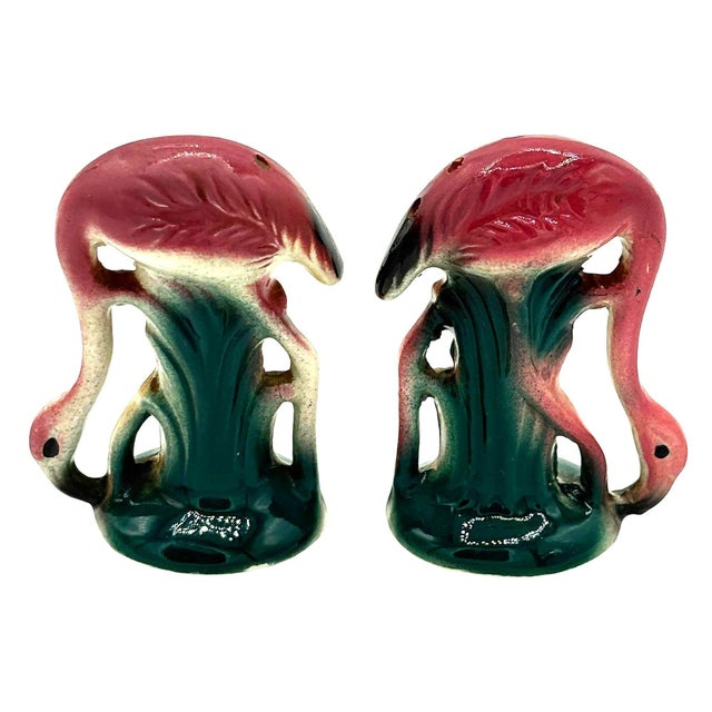 Mid-century pink and green ceramic flamingo tabletop salt & pepper shaker set. The set features two beautifully detailed...