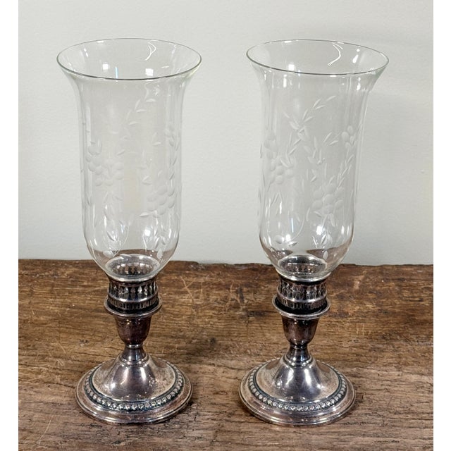 High quality vintage pair of International Sterling weighted reinforced hurricane candlesticks with flared etched crystal...