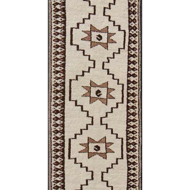 Brown and cream tribal and modern design Turkish Tulu in geometric medallions, Long Tulu runner. Keivan Woven Arts / rug...