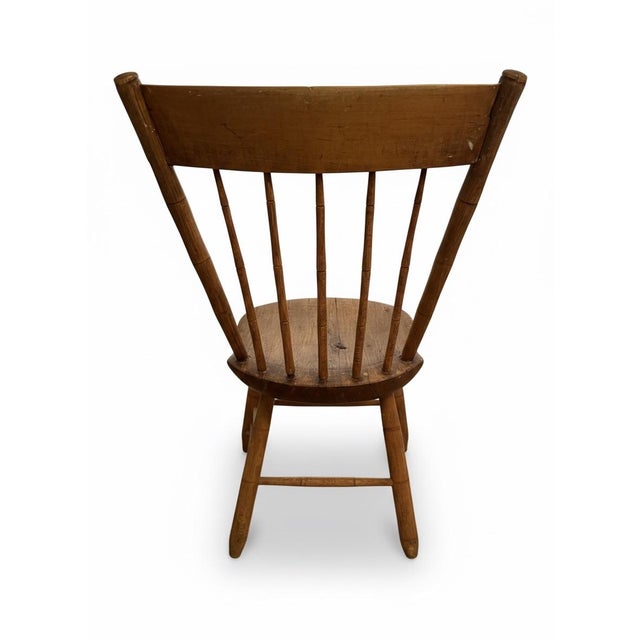 A beautifully timeworn primitive Windsor side chair from the estate of Clark Gable, sold at Christie’s “Film and...