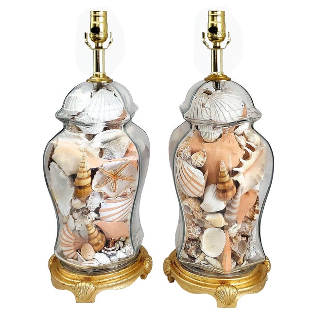 Offering a pair of rare seashell lamps, circa 1980s. These luxurious large and heavy vintage glass seashell lamps have...