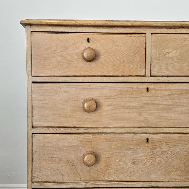 A charming and well-proportioned antique pine chest of drawers, offering a lighter, more elevated presence while retaining...