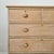 A charming and well-proportioned antique pine chest of drawers, offering a lighter, more elevated presence while retaining...