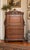 A beautifully detailed late 19th-century Victorian Renaissance Revival drop-front secretary featuring an architectural...