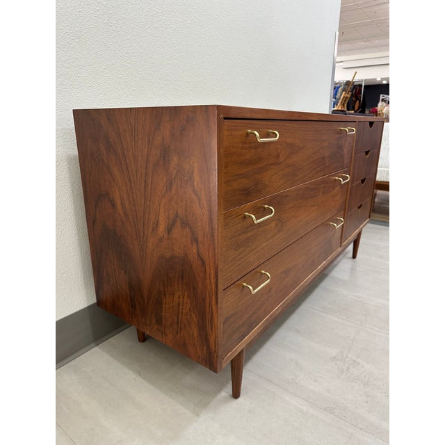 Gorgeous American of Martinsville dresser, circa 1960s from the “Dania” series. The dresser has been refinished, rich...