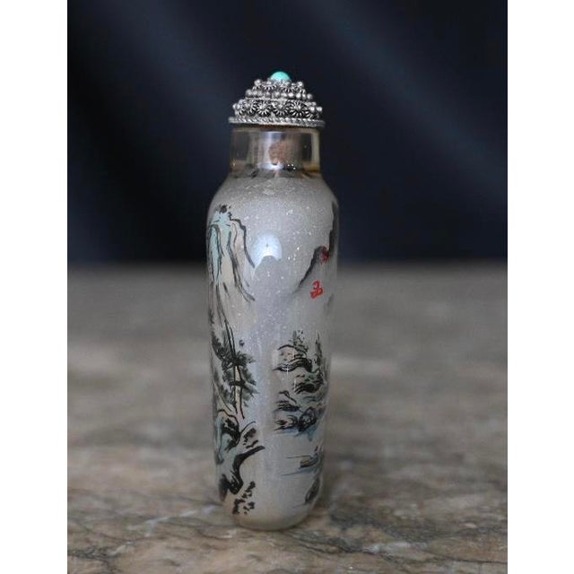 This exquisite Chinese inside-painted snuff bottle is a rare work of art, handcrafted with meticulous detail. Dating back...